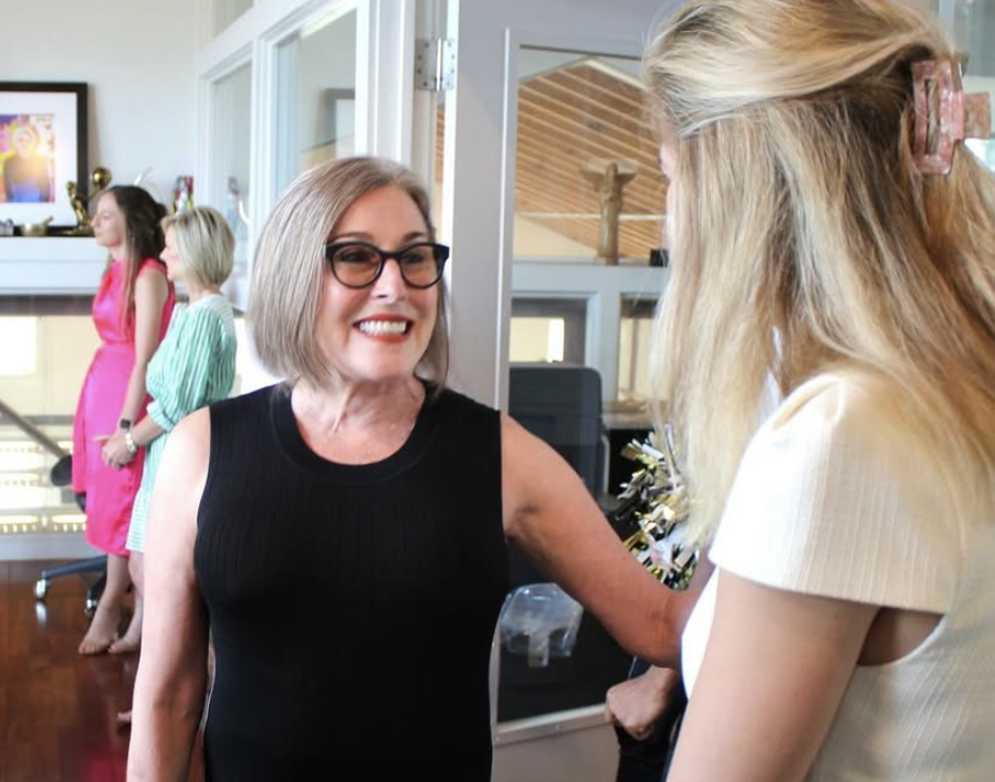 - Paris Parker Aveda Salons and Spas - Baton Rouge, New Orleans, Mandeville, LA A woman in a black sleeveless top smiles while talking to another woman in a white top, perhaps discussing a recent facial; two other women stand in the background of a bright indoor space. - Paris Parker Aveda Salons and Spas - Baton Rouge, New Orleans, Mandeville, LA