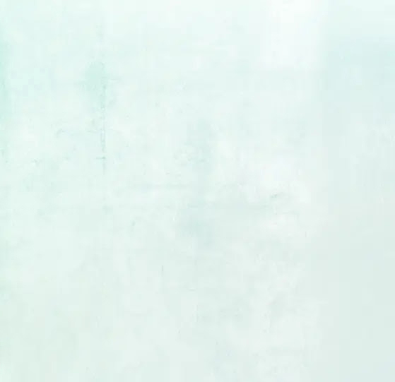 - Paris Parker Aveda Salons and Spas - Baton Rouge, New Orleans, Mandeville, LA A light blue and white textured background with subtle, uneven coloration and faint marks, perfect for promoting a tranquil Aveda Salon or highlighting a relaxing facial experience. - Paris Parker Aveda Salons and Spas - Baton Rouge, New Orleans, Mandeville, LA