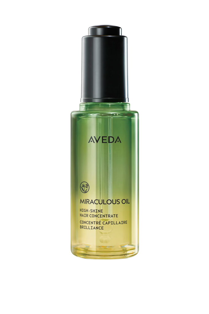 - Paris Parker Aveda Salons and Spas - Baton Rouge, New Orleans, Mandeville, LA A green and yellow gradient bottle of Aveda Miraculous Oil High-Shine Hair Concentrate with a black cap, shown on a white background—perfect for achieving that Hair Salon shine at home. - Paris Parker Aveda Salons and Spas - Baton Rouge, New Orleans, Mandeville, LA
