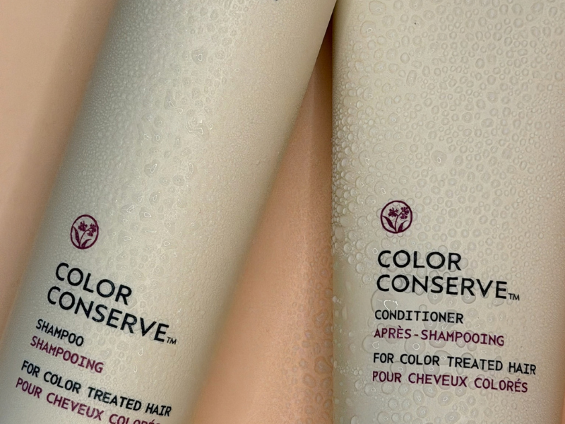- Paris Parker Aveda Salons and Spas - Baton Rouge, New Orleans, Mandeville, LA A bottle of Aveda Color Conserve shampoo and a matching conditioner covered in water droplets. - Paris Parker Aveda Salons and Spas - Baton Rouge, New Orleans, Mandeville, LA